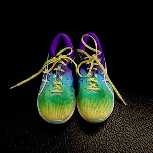 ASICS GT1000 road running shoe in blue, yellow, and green.